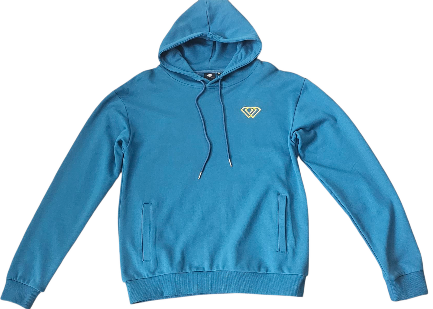 Petrol blue hoodie with a logo on a light blue background for winter and autumn