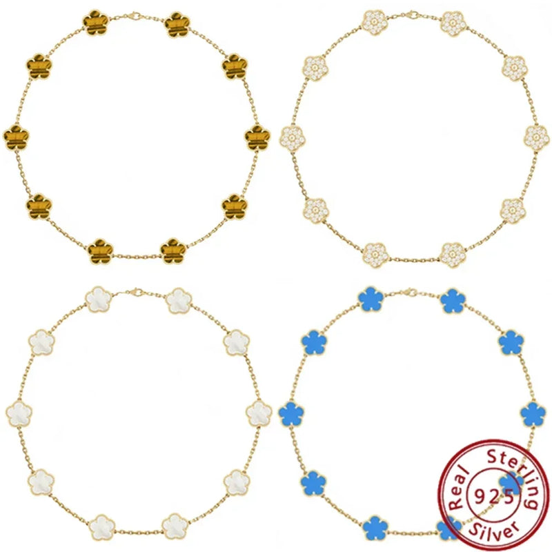 Jstoremart presents a beautiful set of four bracelets arranged in a grid, ideal for weddings or engagements. Each bracelet features distinctive charms: gold flowers, white flowers, blue flowers, and delicate white clovers. The elegance is further enhanced by the Real 925 Sterling Silver stamp on each piece.