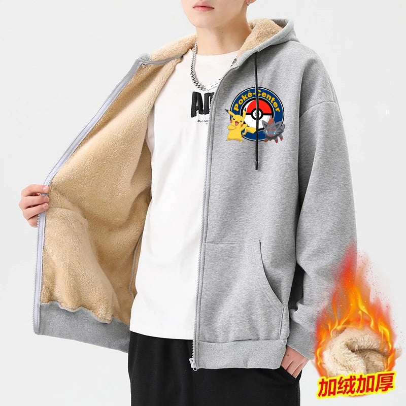 Jstoremart's gray zip-up hoodie showcases whimsical Pikachu designs. The front highlights a logo featuring a Pokéball and Poké-Center, while the back displays four playful cartoon Pikachu images dressed as iconic Pokémon characters, accompanied by Pokémon text underneath. The hood is lined with snug lamb wool for added comfort.