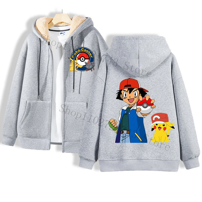 A cozy gray hoodie from Jstoremart showcases a Pokemon Center logo on the front, with charming Pikachu illustrations dressed in various costumes, reminiscent of playful puppets, adorning the back. It's layered over a white shirt, both elegantly displayed on a wooden hanger.